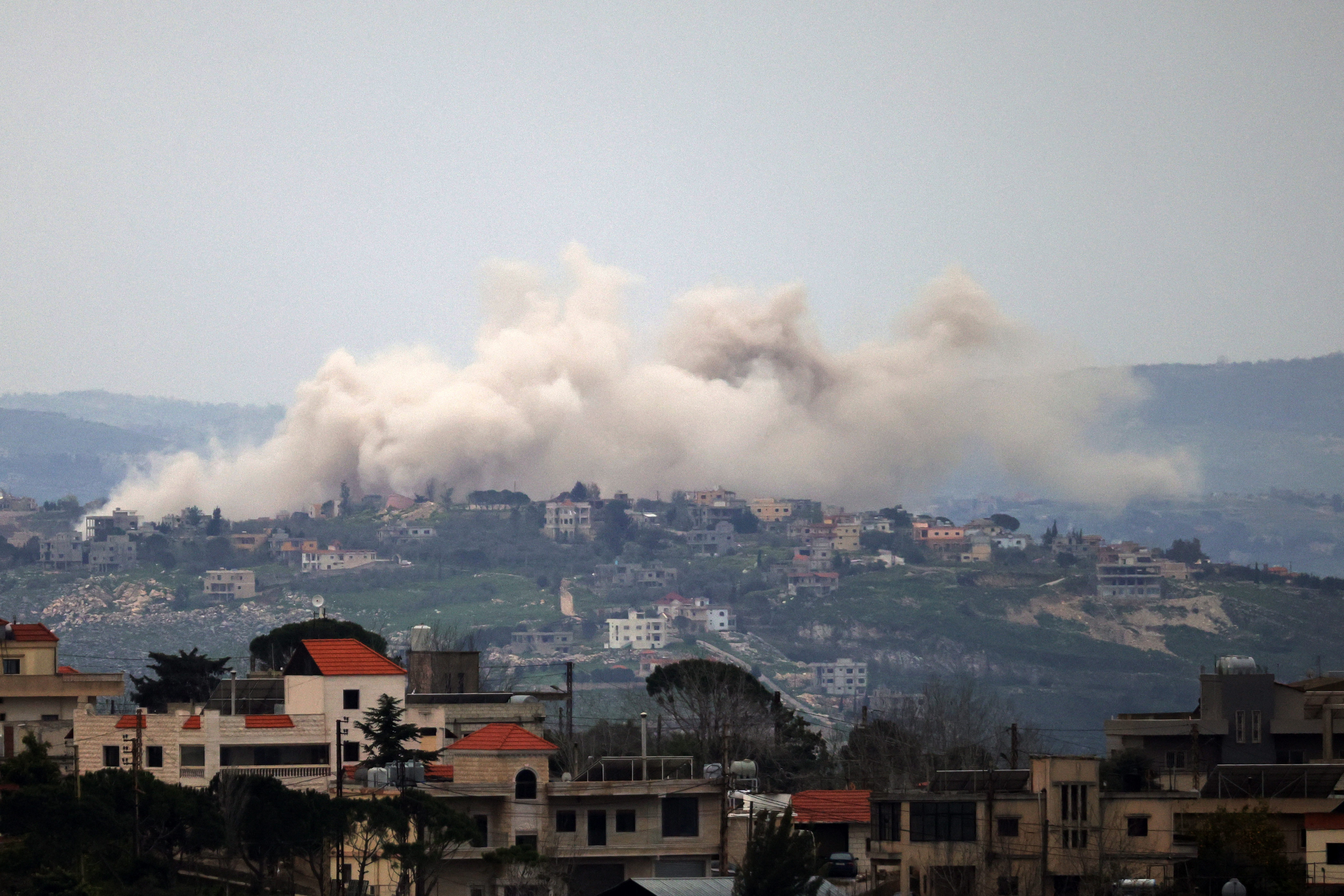 Smoke rises from explosions during Israeli military operations in the Lebanese village of Taybeh