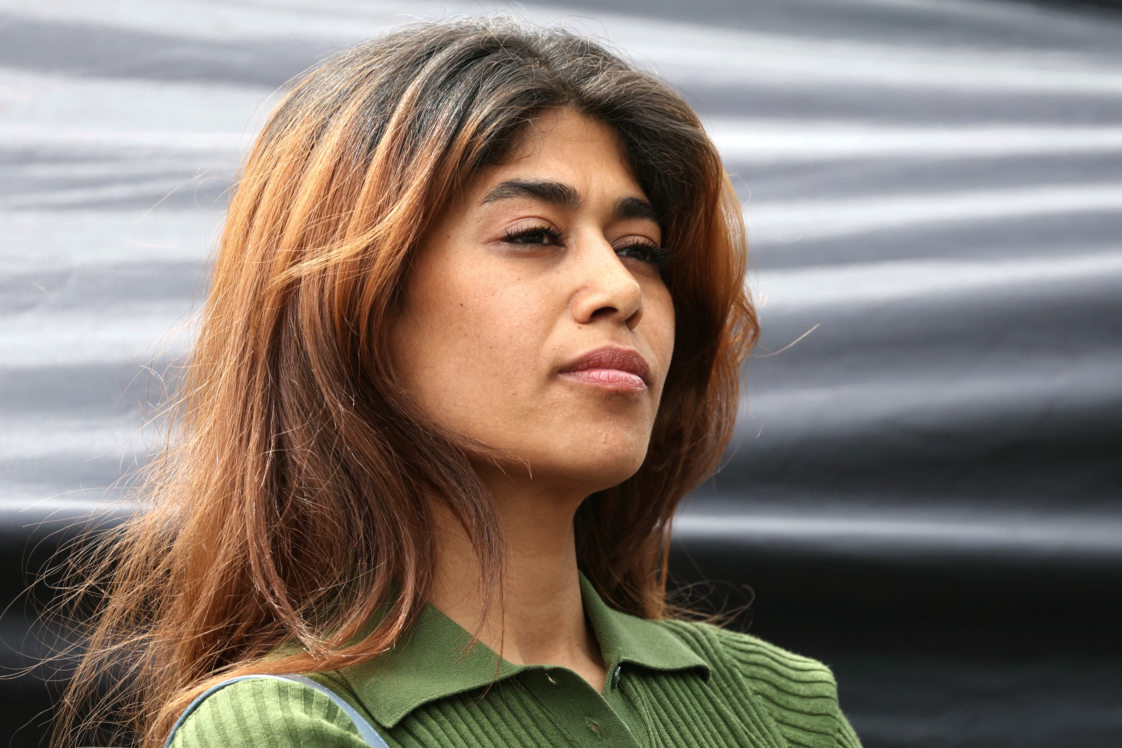 (FILES) French-Palestinian lawyer and member of European Parliament for La France Insoumise (LFI) party Rima Hassan takes part in a pro-Palestinian demonstration called by several French unions at the Place de la Republique in Paris on June 14, 2025.