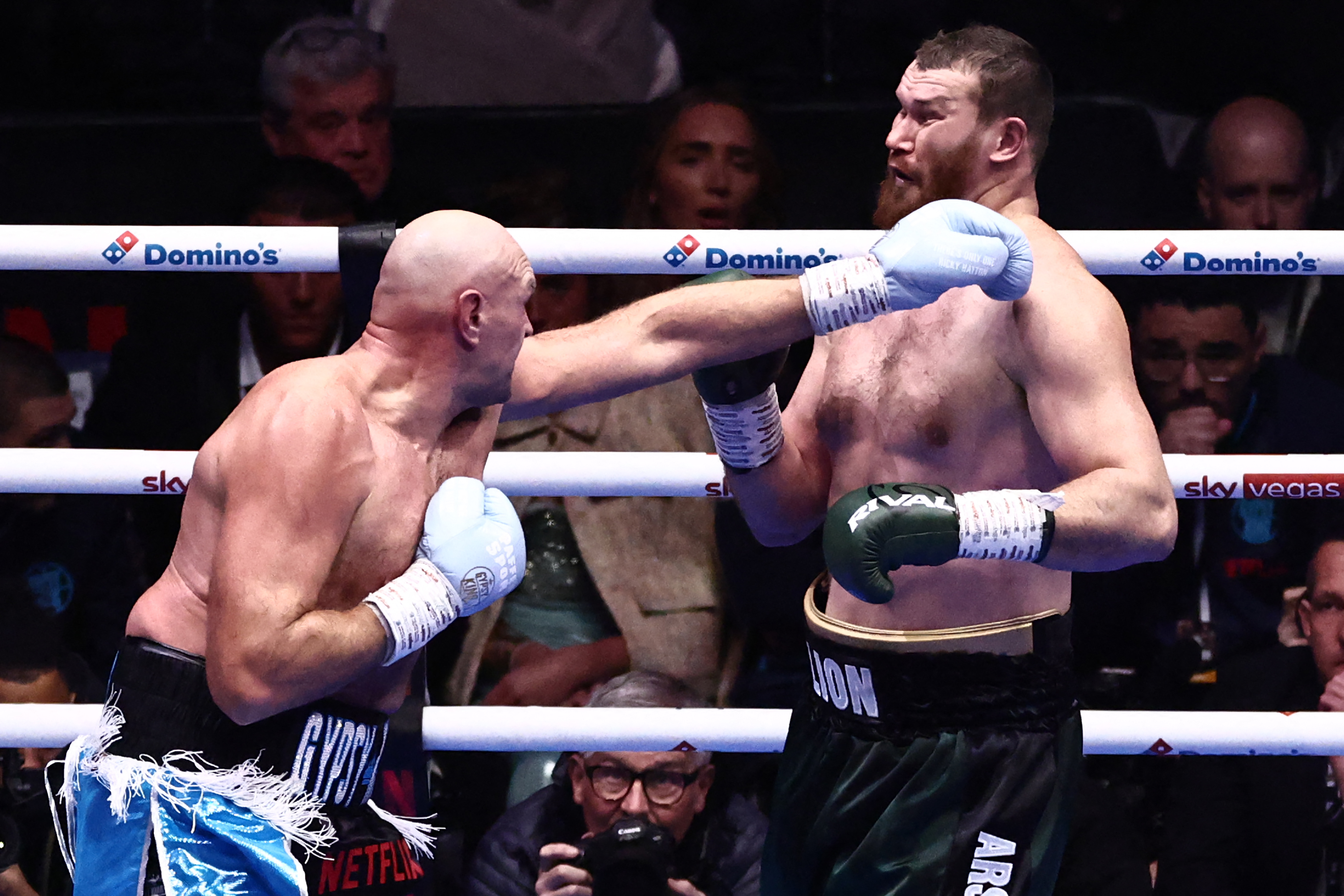 Britain's Tyson Fury (L) throws a jab against Russia's Arslanbek Makhmudov (R) during their heavyweight 'Clash of the Giants' contest at the Tottenham Hotspur stadium in London on April 11, 2026.