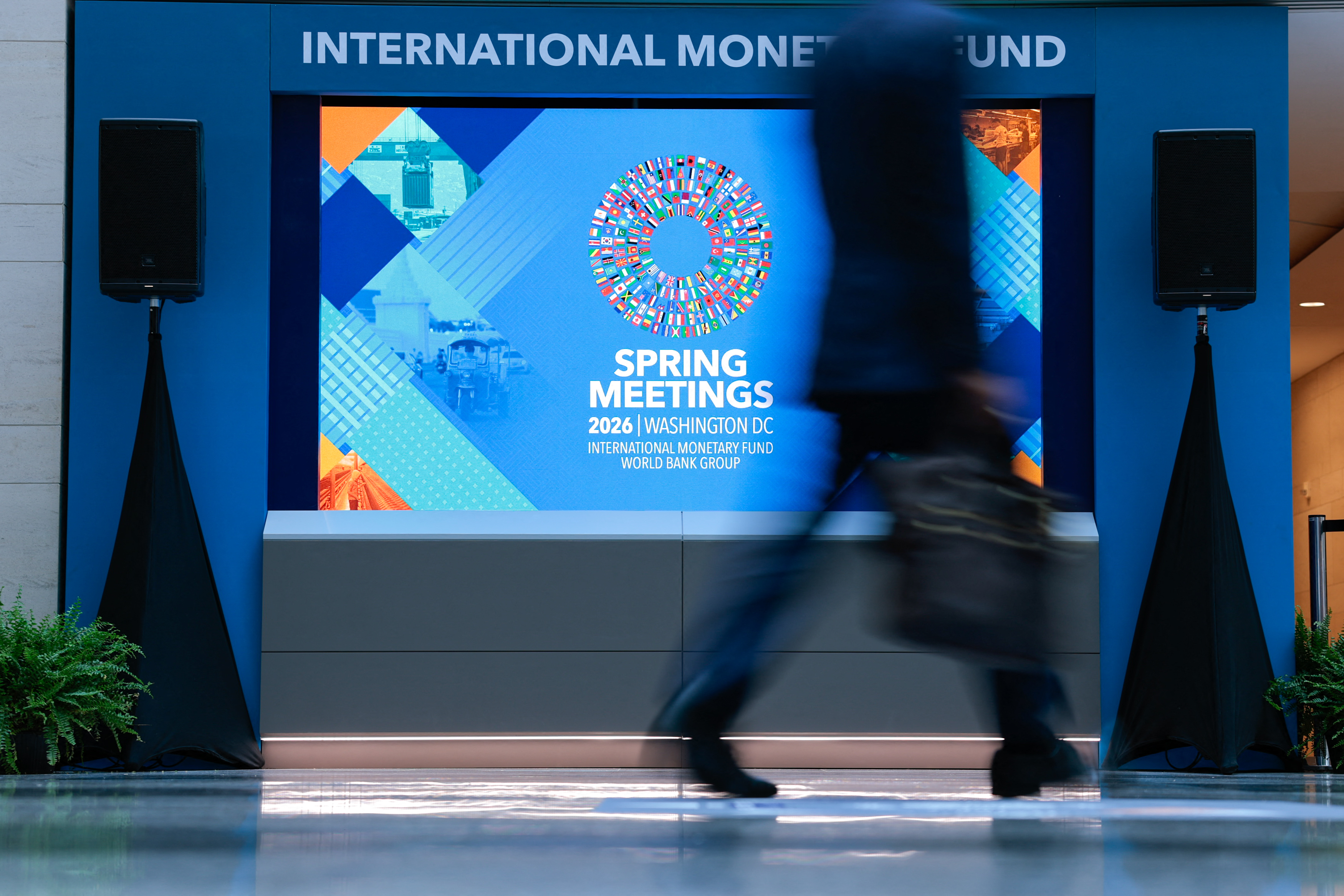 A man walks through the atrium during the 2026 IMF and World Bank Group Spring Meetings in Washington, DC, on April 14, 2026.