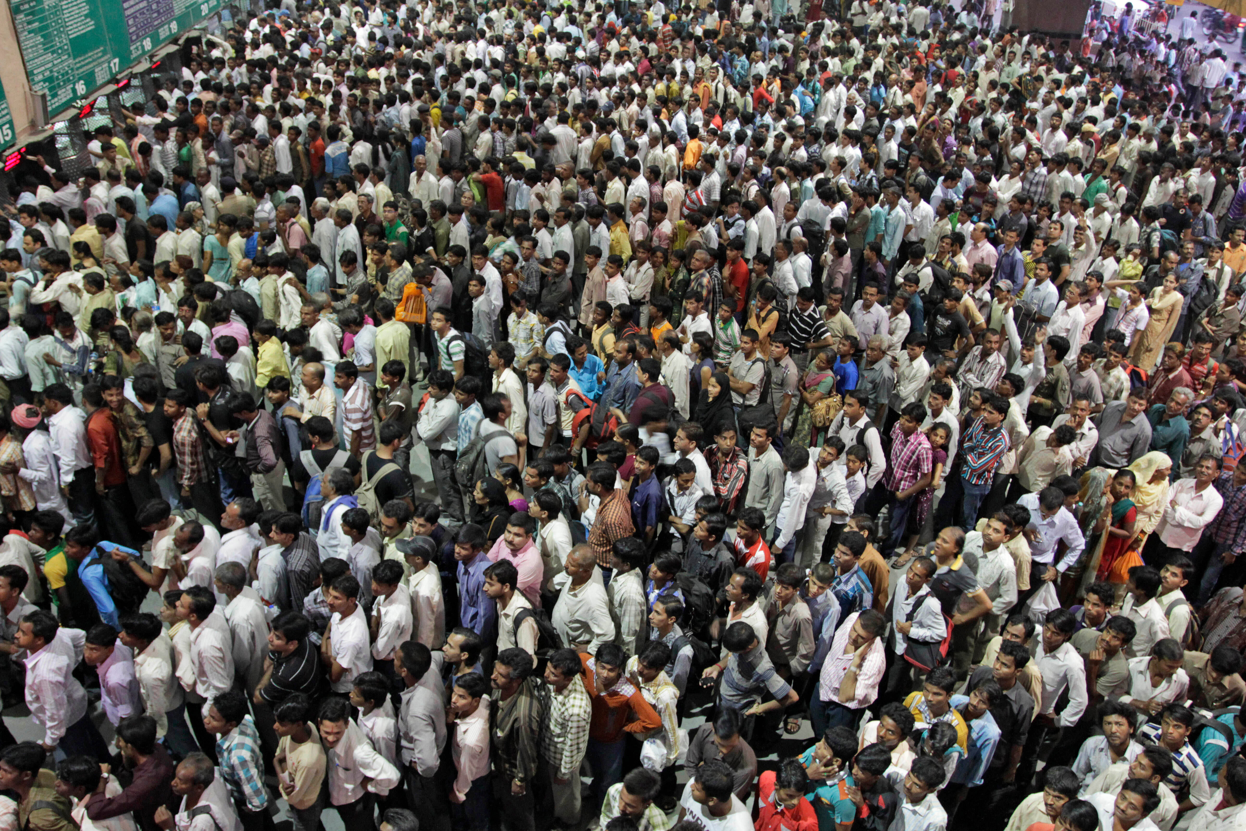 Indians crowd ticket counters at a railway station in Ahmedabad