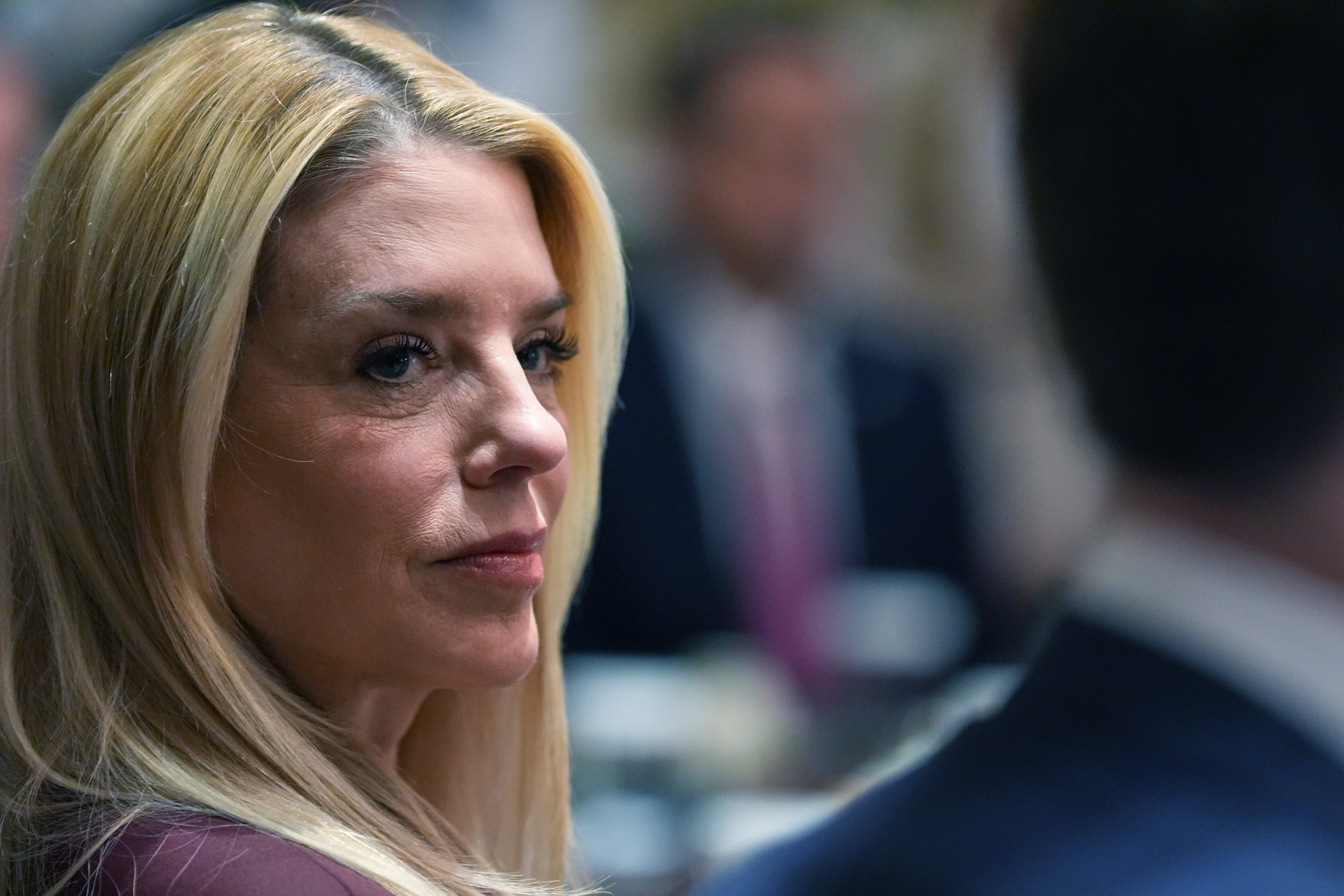 Attorney General Pam Bondi listens during a Cabinet meeting at the White House, Thursday, March 26, 2026, in Washington. (AP Photo/Alex Brandon)