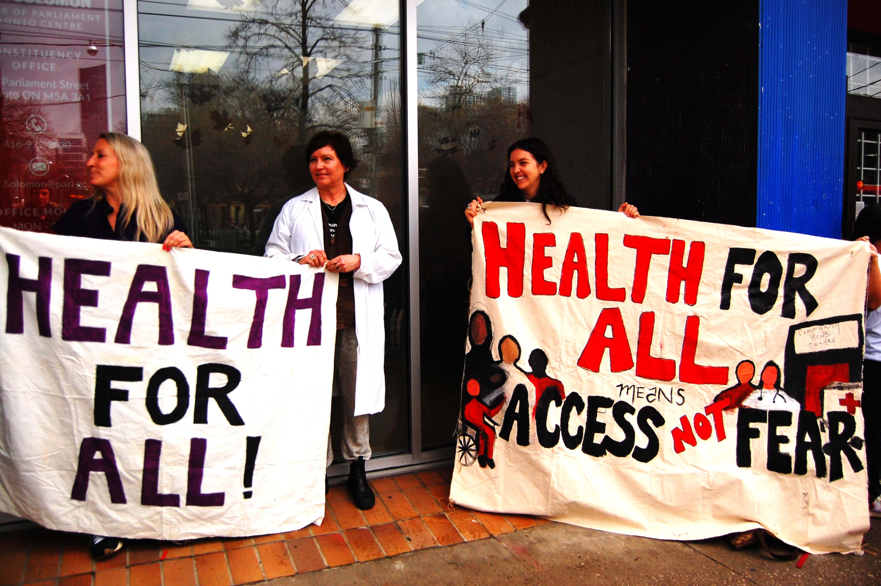 Health workers and rights activists rally against planned cuts to a refugee healthcare programme, in Toronto, Canada, April 14, 2026