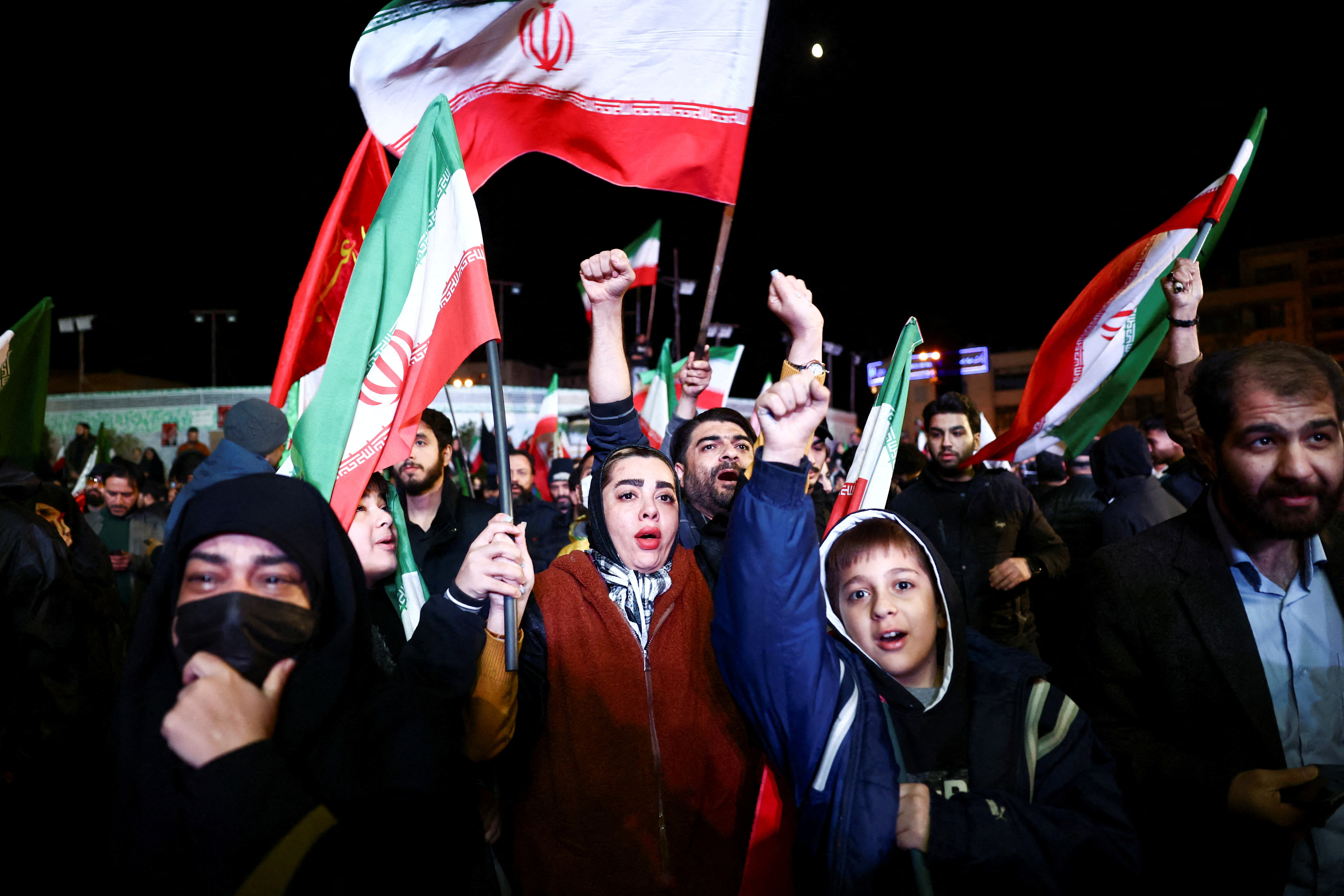 People wave flags as they gather after a two-week ceasefire in the Iran war was announced, in Tehran, Iran, April 8, 2026. Majid Asgaripour/WANA (West Asia News Agency) via REUTERS ATTENTION EDITORS - THIS PICTURE WAS PROVIDED BY A THIRD PARTY. TPX IMAGES OF THE DAY