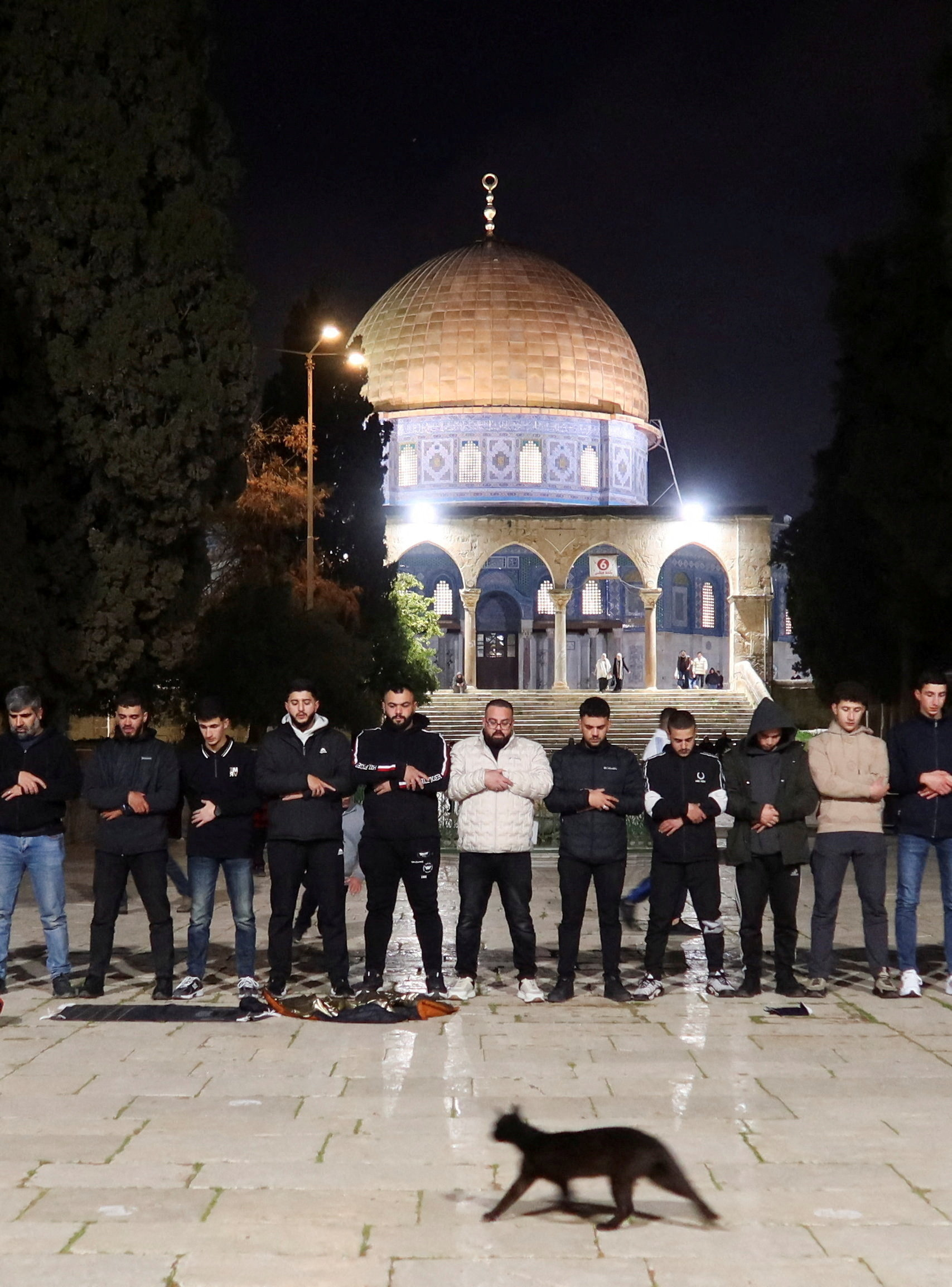 Muslim worshippers pray in front of the Dome of the Rock at Al-Aqsa compound, also known to Jews as the Temple Mount, amid a two-week ceasefire in the Iran war, in Jerusalem, April 9, 2026. REUTERS/Sinan Abu Mayzer REFILE - CLARIFYING CAPTION FROM "FOLLOWING" TO "AMID".
